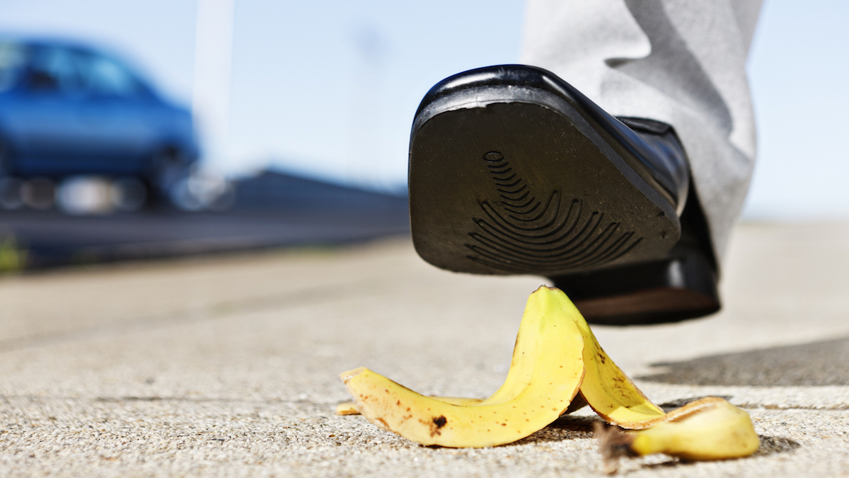 Painful slip coming as man's foot approaches banana peel